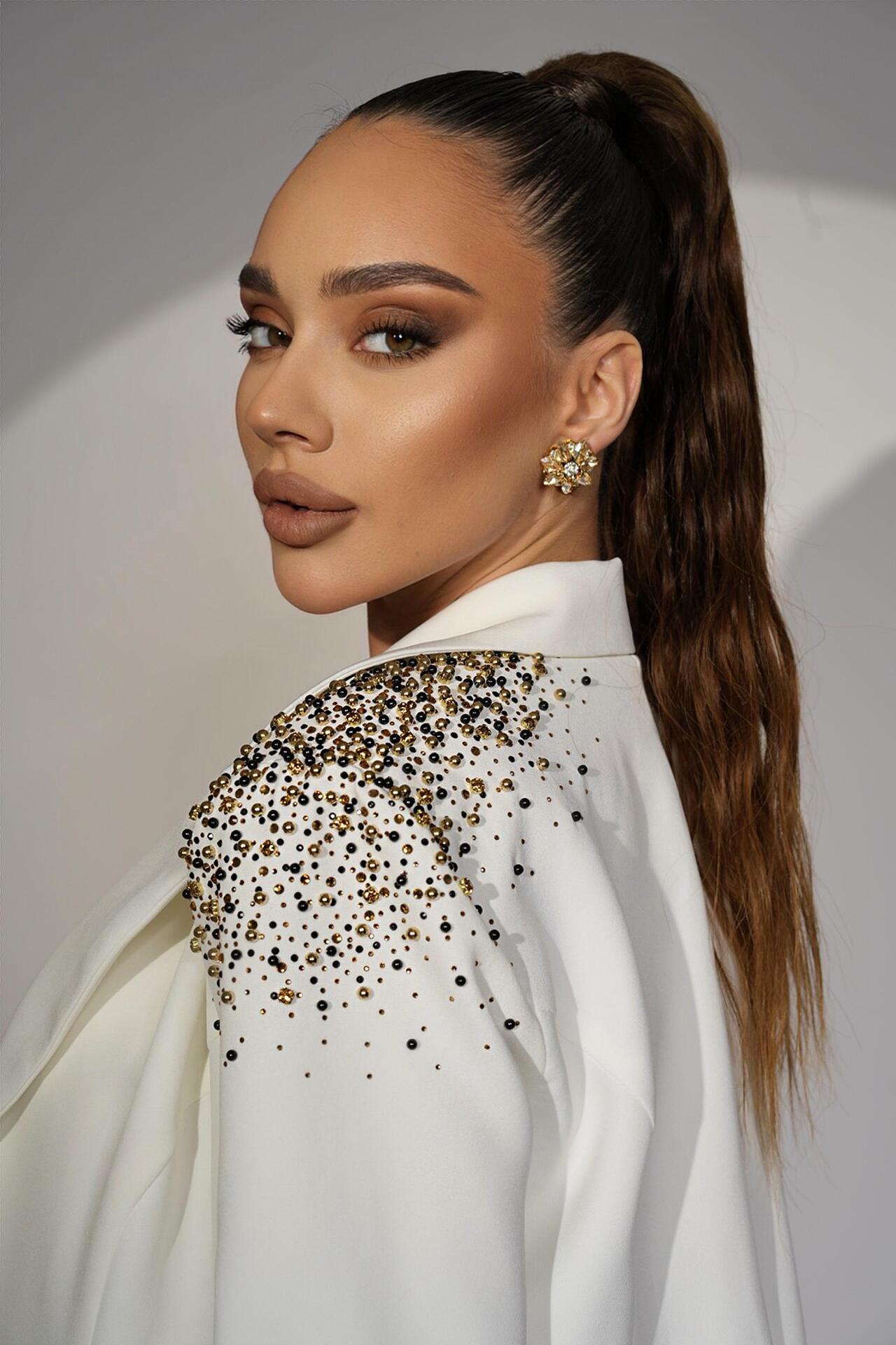 White jacket with golden crystals and stones