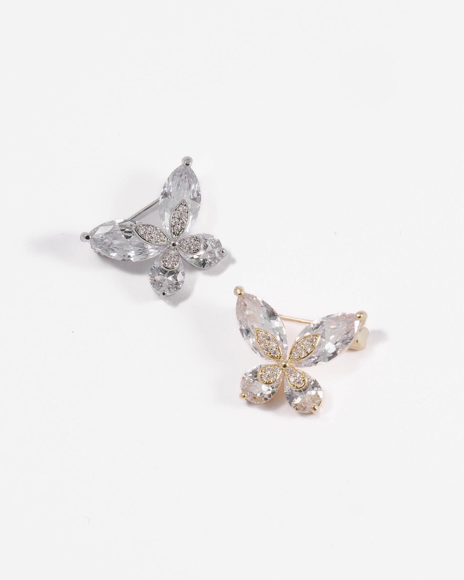 Delicate brooch with stones: in silver and gold
