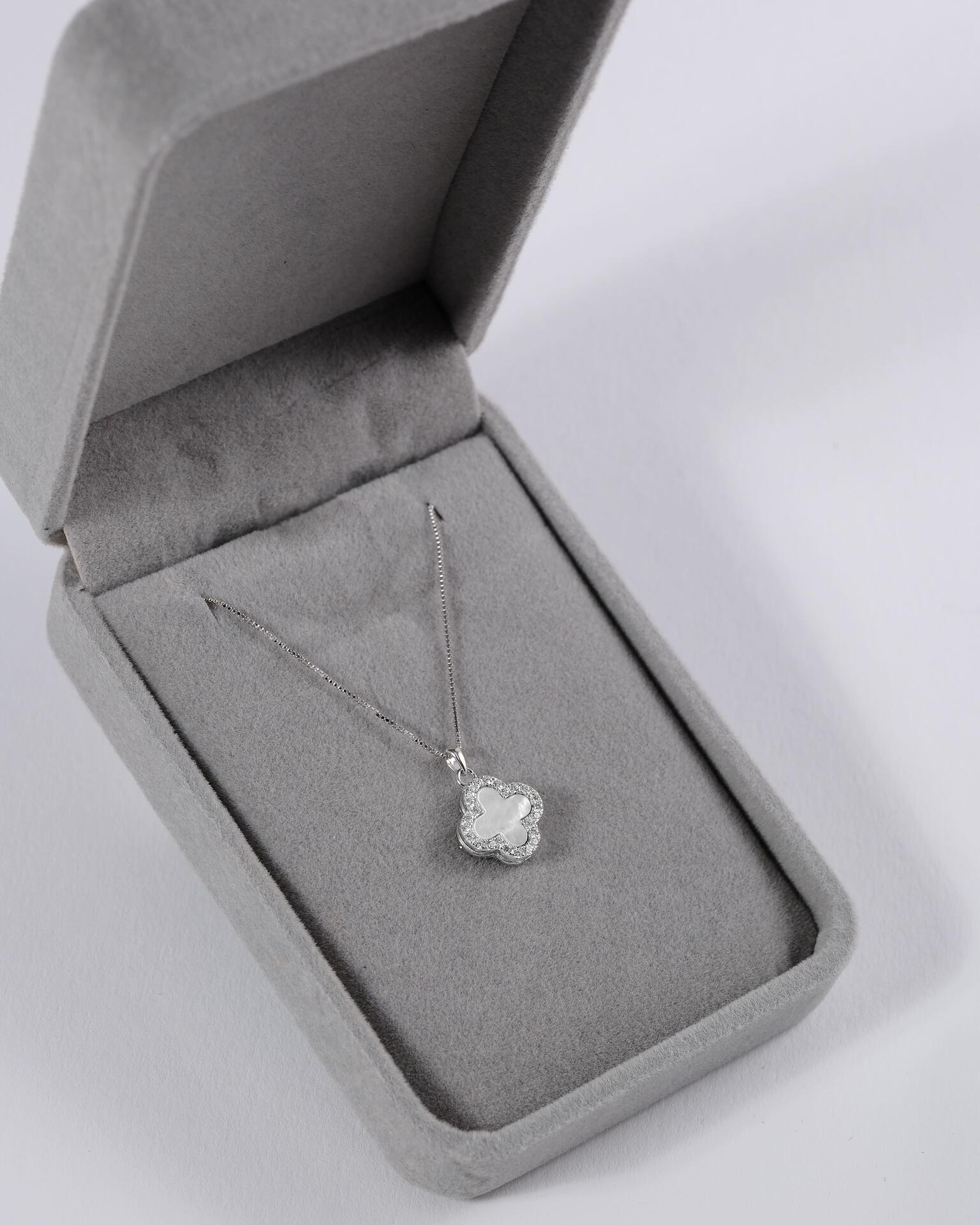 Silver necklace with a flower-shaped pendant