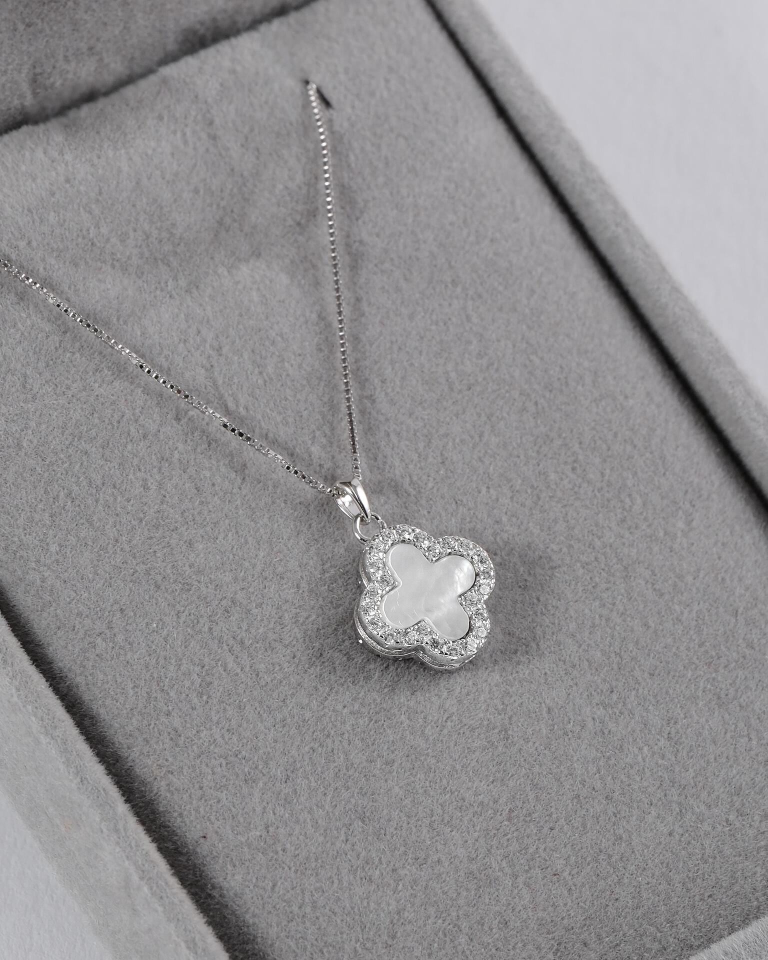 Silver necklace with a flower-shaped pendant