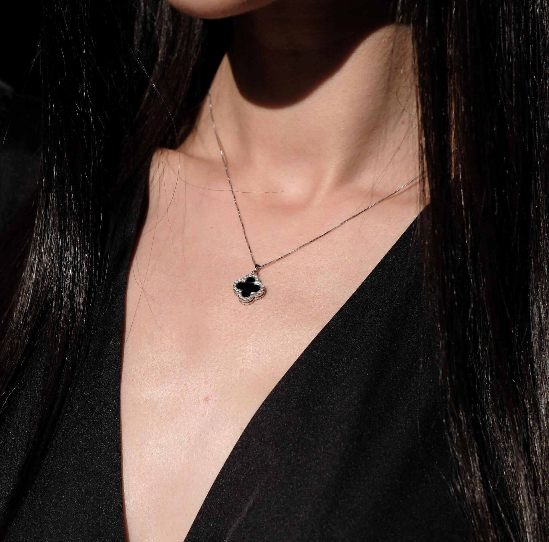 Silver necklace with a flower-shaped pendant