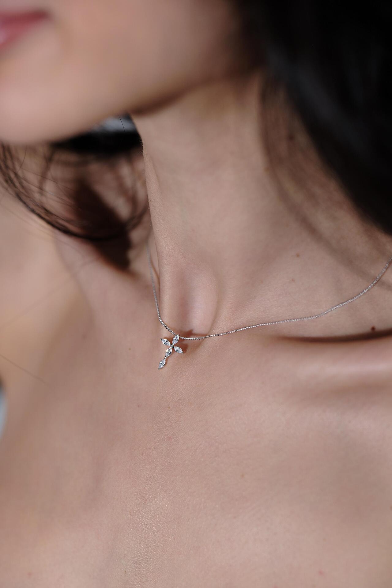 Silver necklace with a cross-shaped pendant