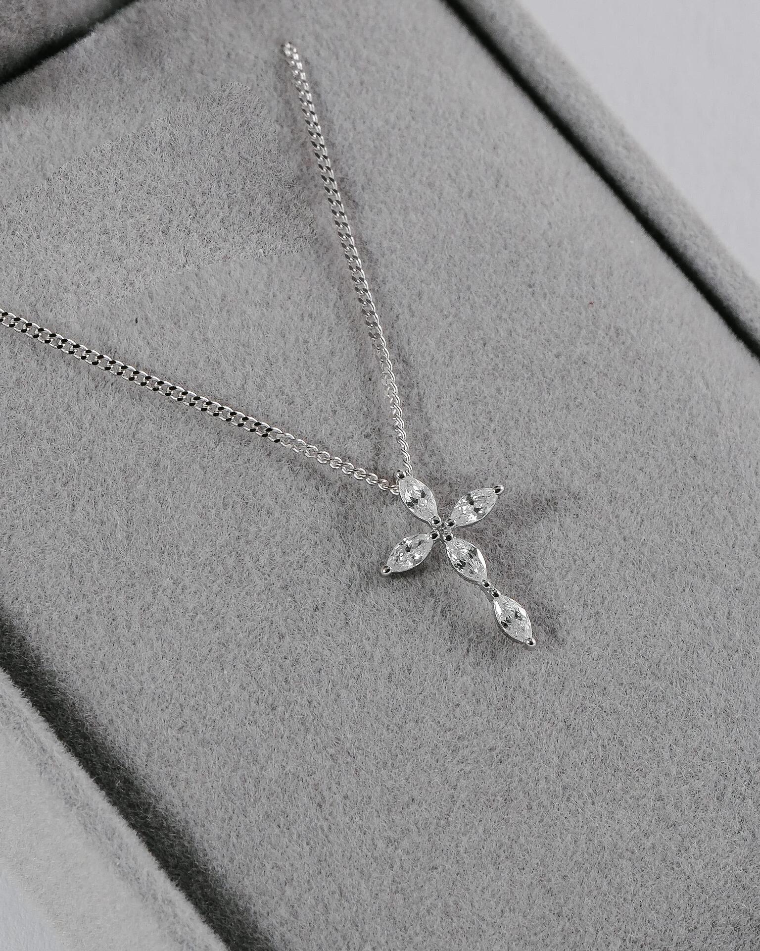 Silver necklace with a cross-shaped pendant