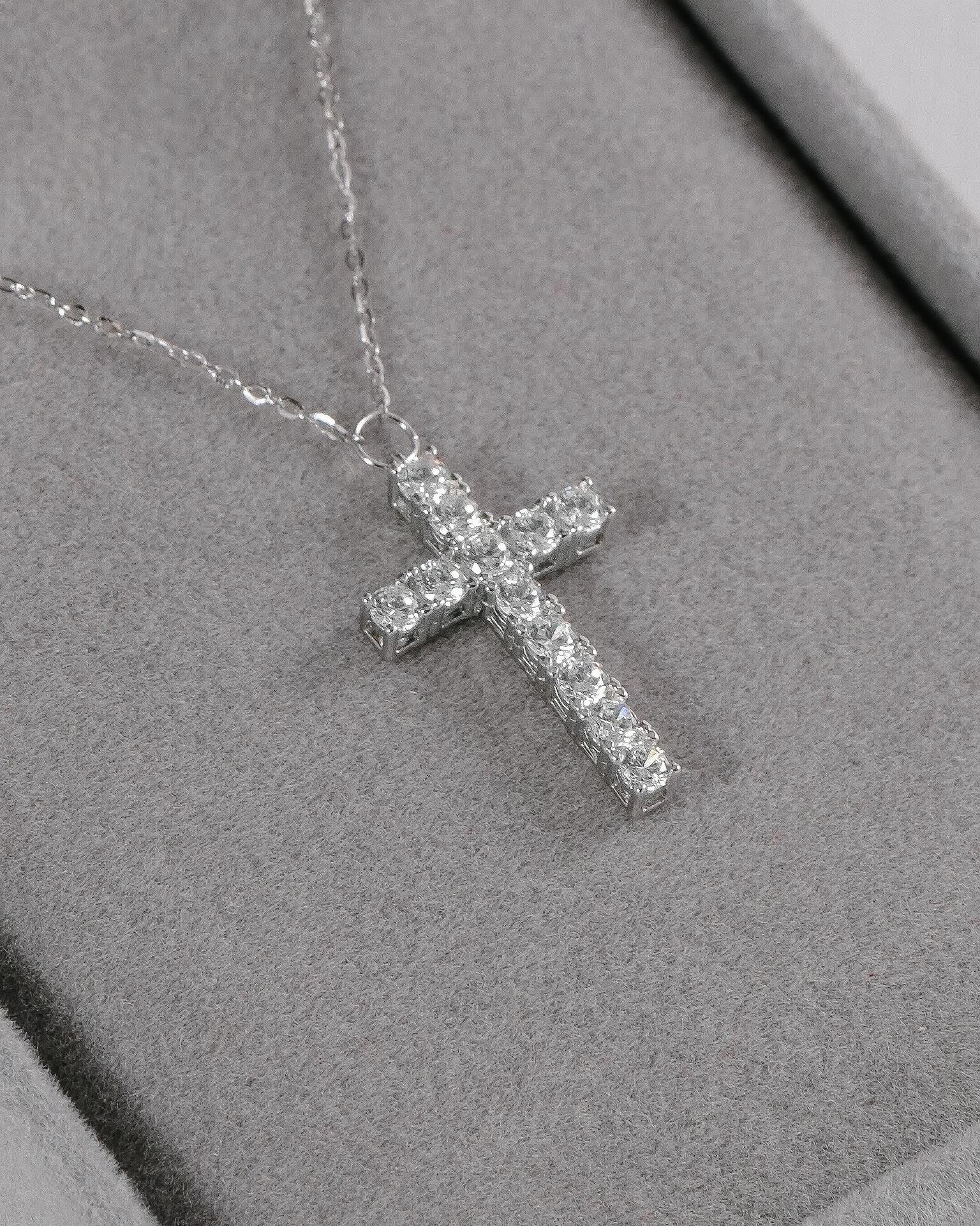 Silver necklace with a cross pendant with stones