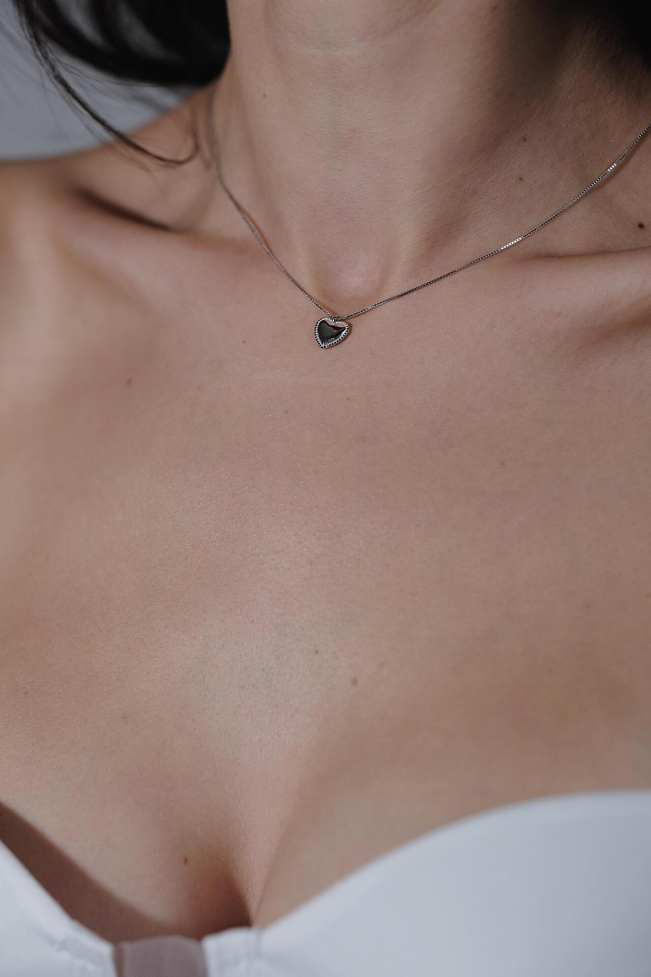 Silver necklace with a heart-shaped pendant