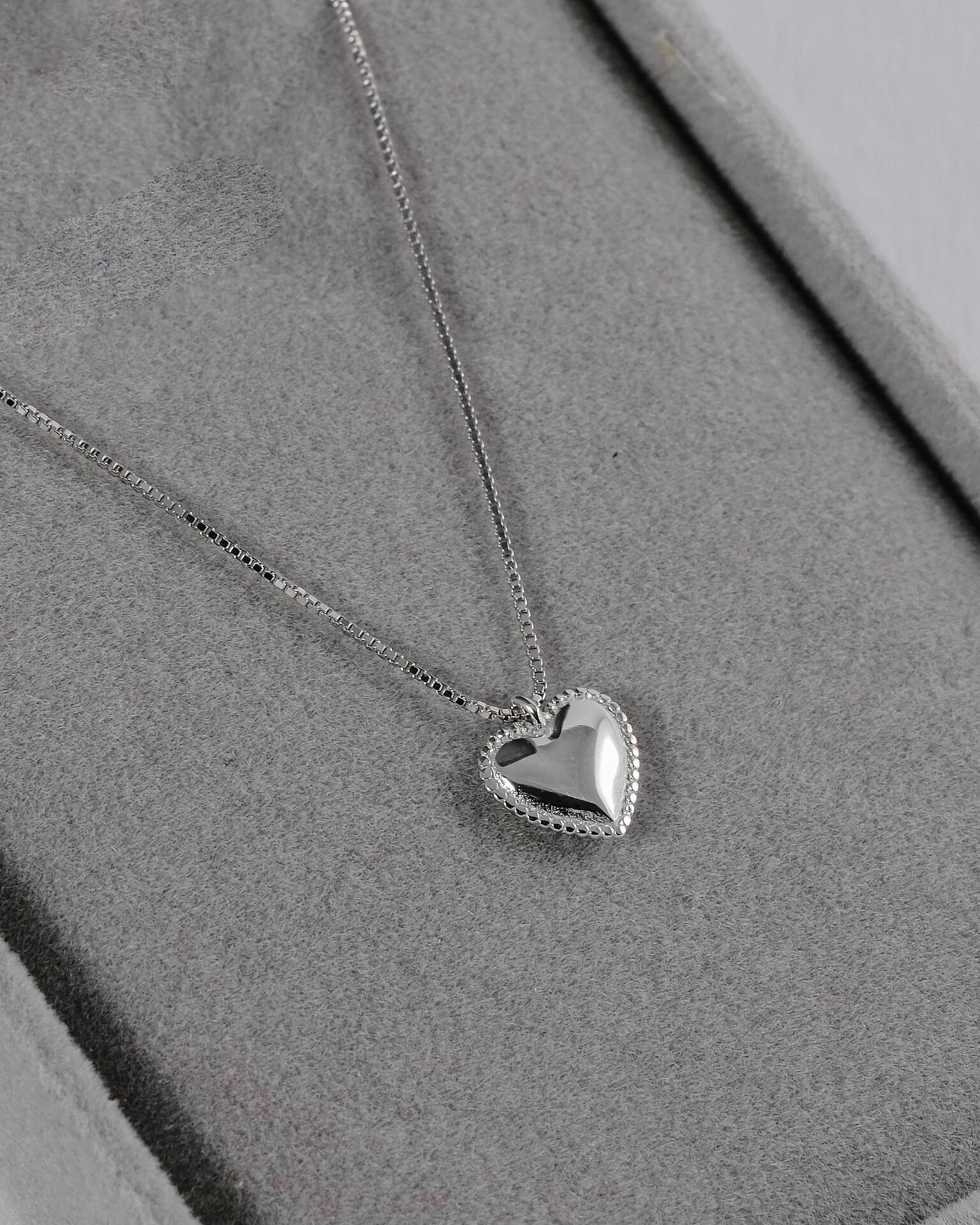 Silver necklace with a heart-shaped pendant