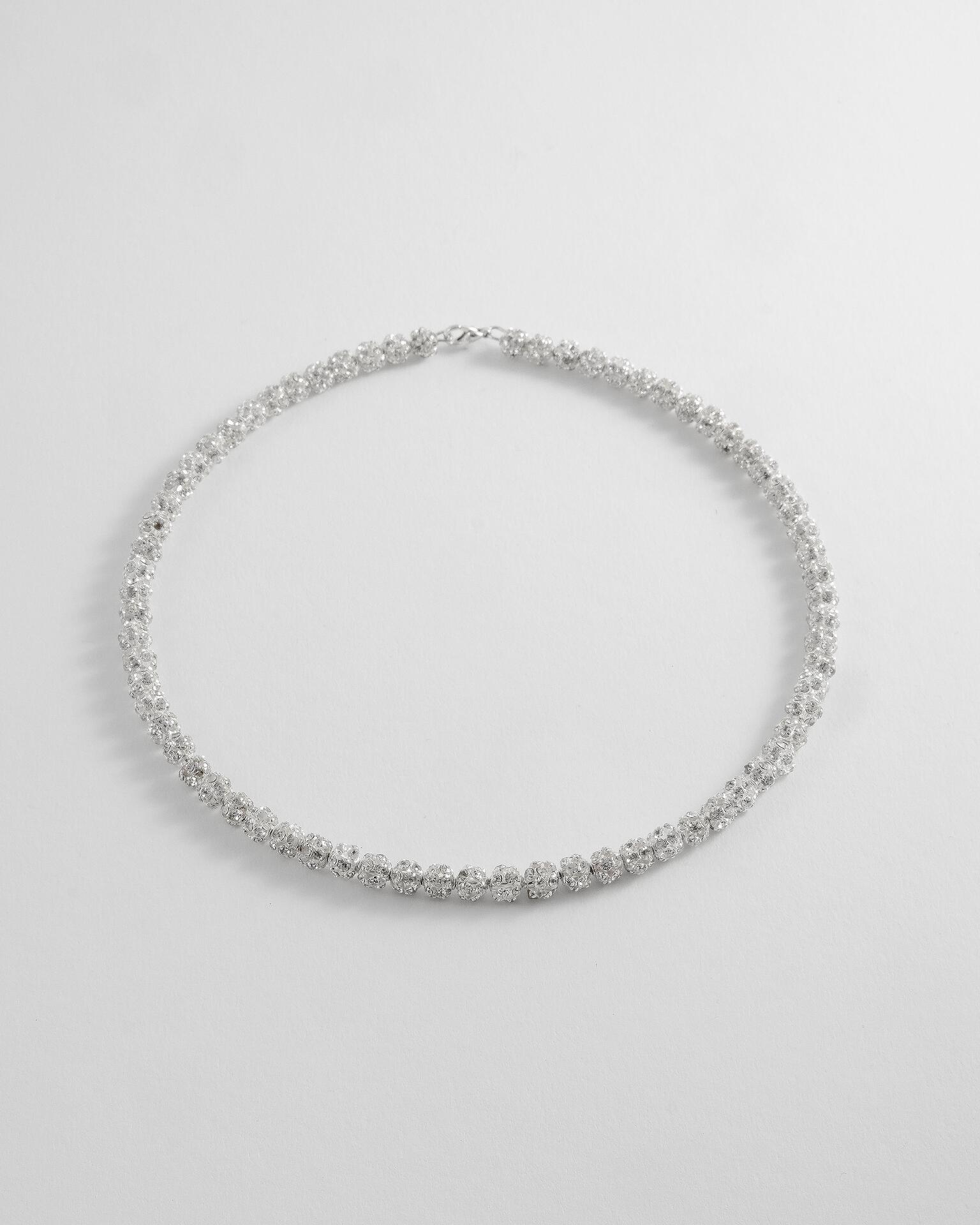 Necklaces with crystals, pearls and stones